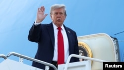 U.S. President Donald Trump boards Air Force One from Joint Base Andrews in Maryland as he departs for Alaska to meet with Russian President Vladimir Putin.