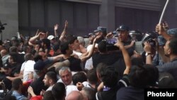 Armenia - Riot police clash with antigovernment protesters outside the Foreign Ministry building in Yerevan, May 31, 2024.