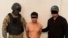 Бекназар Бөрүгул уулун кармоо учурунда тартылган сүрөт. УКМКнын сүрөтү.