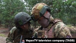 "Вагнер" менчик аскердик компаниясынын жалданма жоочулары Беларуста. 20-июль, 2023-жыл. Видеодон алынган кадр.
