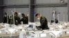 Members of Czech Army set up equipment and beds inside of an exhibition center to accommodate people who suffer mild coronavirus disease (COVID-19) symptoms in Prague, Czech Republic, October 22, 2020. REUTERS/David W Cerny
