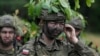 O femeie soldat la instrucție în Polonia, pe 20 iunie 2024. 