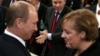 Russian President Vladimir Putin talks to German Chancellor Angela Merkel during the 43rd Munich Conference on Security Policy in 2007, the only time the Kremlin leader attended the event. 