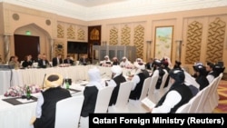 FILE: In Doha, the Taliban, U.S. and Qatari officials attend peace talks about Afghanistan. 