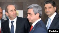 Armenia - Outgoing President Robert Kocharian (L), President-elect Serzh Sargsyan (C) and Central Bank Chairman Tigran Sarkisian attend the inauguration of a commercial bank headquarters in Yerevan, 4Apr2008.