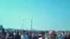 Iranians gather to mourn those killed during protests against last month's disputed presidential election.