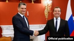 Russia - Prime Minister Dmitry Medvedev (R) and his Armenian counterpart Tigran Sarkisian meet in Sochi, 24Feb2014.