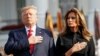 U.S. President Donald Trump and first lady Melania Trump observe a moment of silence to mark the 18th anniversary of the September 11 attacks on the South Lawn of the White House in Washington.