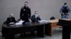 Alexei Navalnîi, în prima zi a noului său proces, în orașul Pokrov, în data de 15 februarie 2022. La finalul procesului, în 22 martie, el a fost condamnat la 9 ani de închisoare.