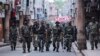 Security personnel patrol a street in Jammu on August 6.