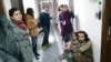 Журналісти бакинського бюро Радіо Свобода, яких вивели з офісу під час обшуку приміщення. Баку, 26 грудня 2014 року
