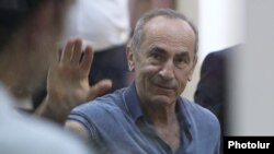 Armenia -- Former President Robert Kocharian waves to supporters during his trial, Yerevan, September 20, 2019.